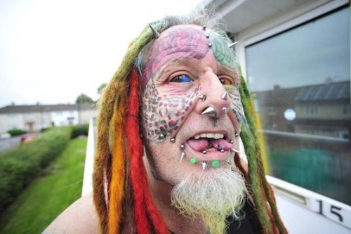 Ted Richards, known as Parrot Nan in the local community prides himself on body modification. It is believed he had now become the first person in the world to have 5 implants in his face including two horns. He has also had his eyes dyed and tongue split. Date: 17/06/15 Photographer: Simon Galloway/Staff. Copyright: Local World